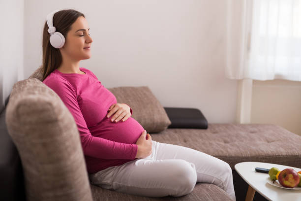 455 Serene Pregnant Lady Listening To Music Stock Photos, Pictures &  Royalty-Free Images - iStock