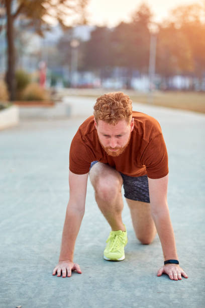 istock Young modern man jogging / exercising in an urban park. 1205951716