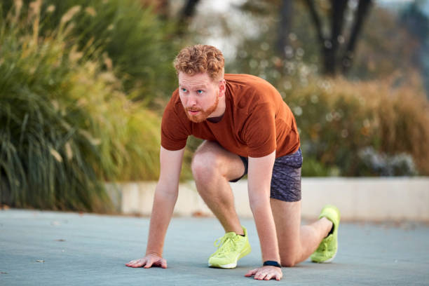 istock Young modern man jogging / exercising in an urban park. 1205951742