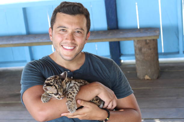 istock South American man holding an ocelot 1205951818
