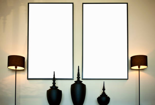 istock Two blank vertical  frames on wall in Atmospheric sunny  living room interior 1205952304