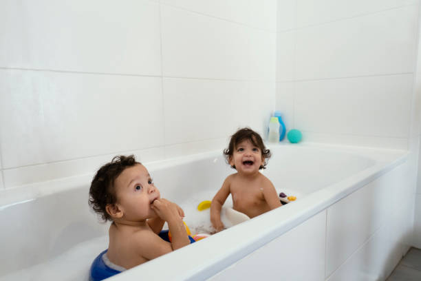 istock Mom and babies at home 1205953528
