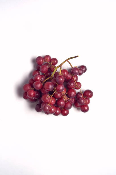 Overhead View Of Bunch Of Red Grapes On White Background