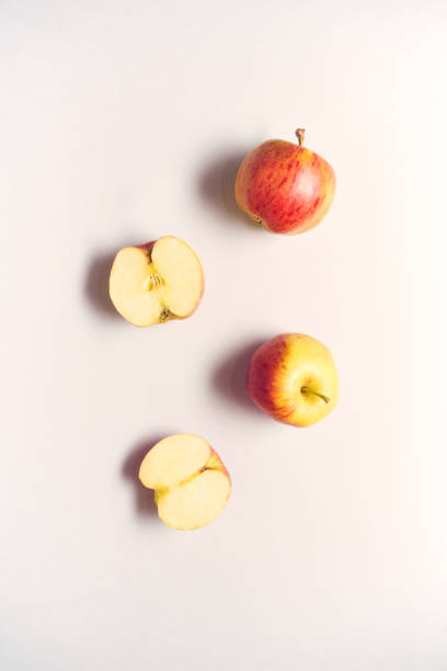 istock Overhead View Of Whole And Halved Fresh Apples On White Background 1205954129