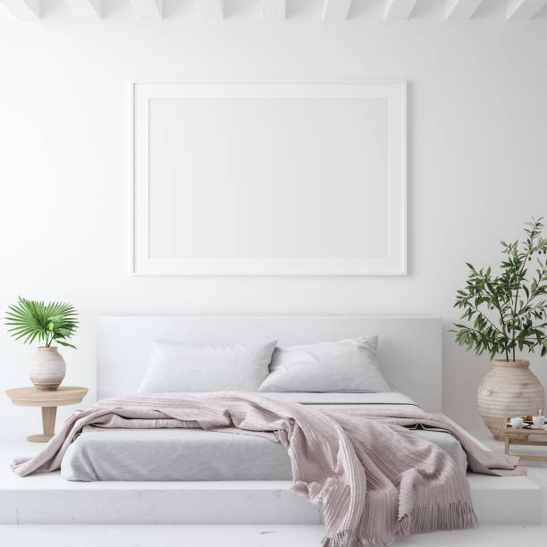 istock Mockup poster frame in white cozy bedroom interior, Scandinavian style 1205954458