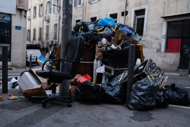 istock household trash piled on street - Stike Protest action 1205956140