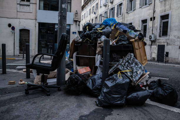 istock household trash piled on street - Stike Protest action 1205956147
