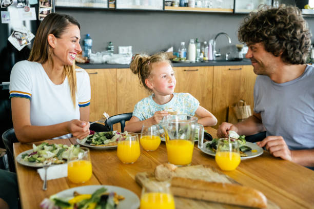 istock Cheerful family having lunch 1205957822