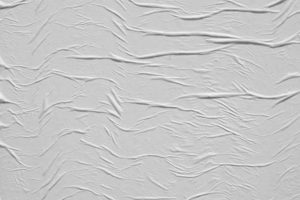 istock Crumpled white paper. Abstract background for the designer. 1205962459