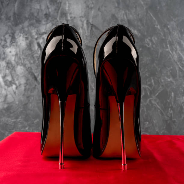istock Black fetish shiny patent leather stiletto high heels with ankle strap 1205967525