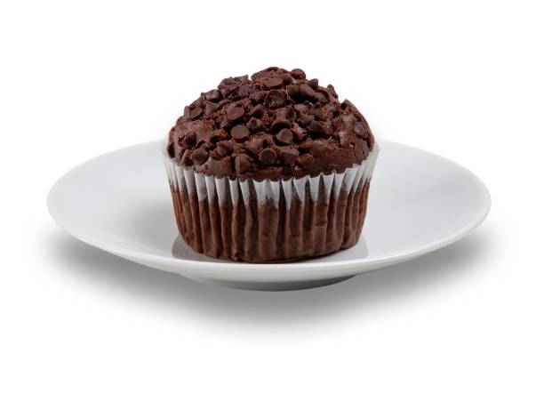 istock Chocolate muffin with choc chips on the top on a white plate, shot on a white background 1205970164