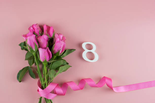 istock Pink Rose flower and 8th Number on pink background with copy space for text. Love, Equal and International Women day concept 1205971881