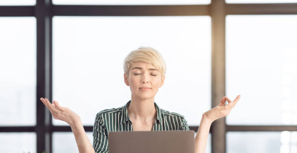 istock Calm Business Lady Meditating During Stressful Day At Workplace, Panorama 1205974990
