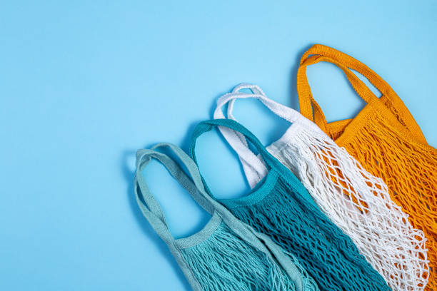 istock Zero waste concept. Textile eco bags on blue background. 1205975357