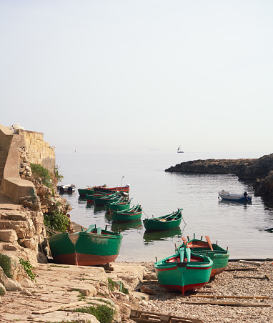 Small rowboats and beach at dawn in a tiny place called  Port'Alga