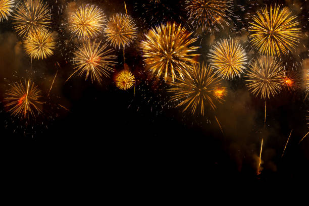 istock Colored firework background with free space for text. Colorful fireworks at night light up the sky. 1205978368