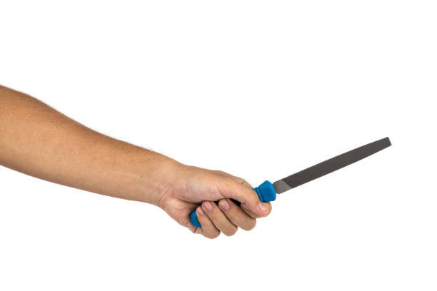 istock Hand of carpenter holding rasp isolate on white background.Equipment of technician.Labor market of joiner and craftsman concept. 1205982714