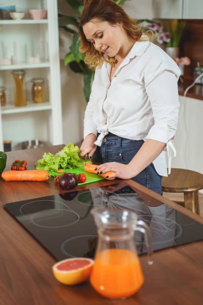 istock Cute female person spending her morning in the kitchen 1205983143