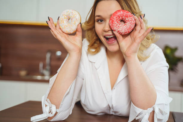 istock Happy young woman looking straight at camera 1205983391