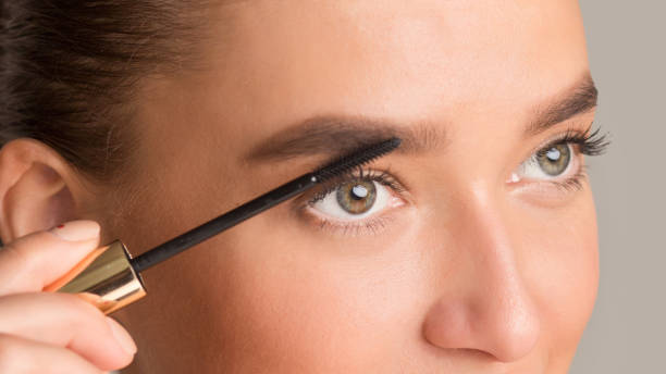 istock Woman combing her eyebrows with brow brush 1205988727