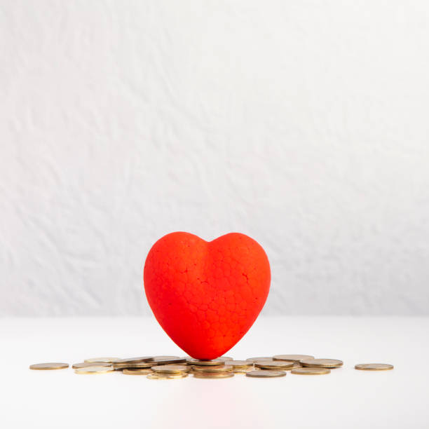 istock Red heart with wedding budget concept and coins 1205988767