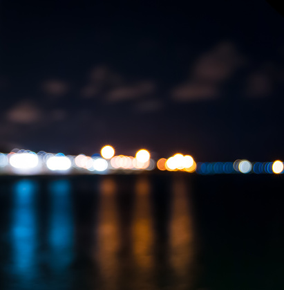 Night light blue and orange with clouds and reflections,bokeh effect.