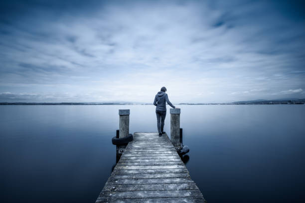 istock The figure on the pier. Lake. Long exposure. 1205989187