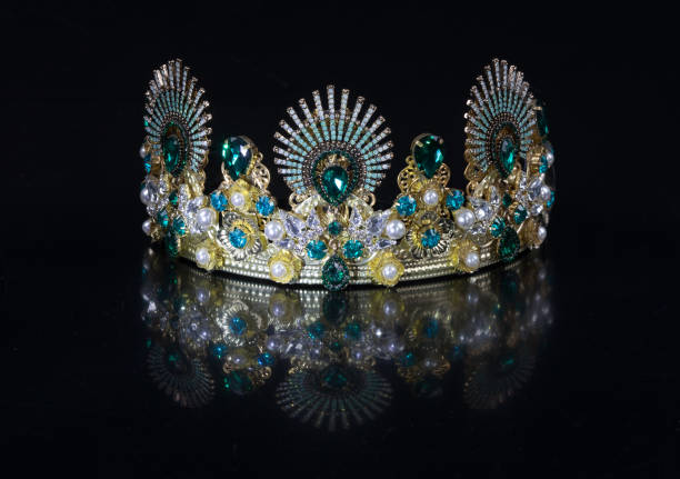 istock queen jewelry crown with precious stones isolated on black background 1205989230