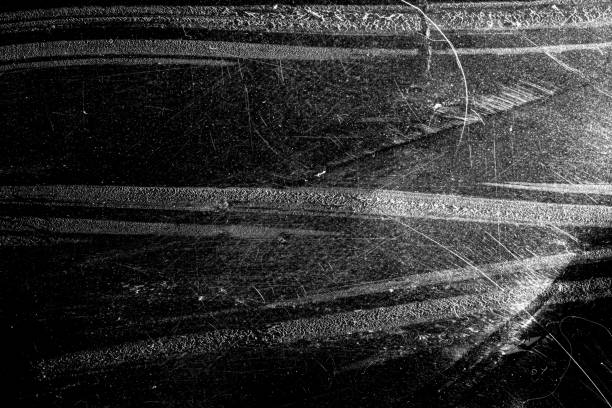 istock white scratches isolated on a black background. 1205989738