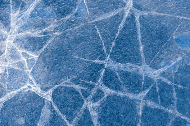 istock beautiful ice with cracks. texture of frozen water 1205989990