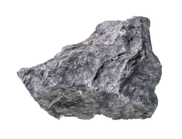 ungeschliffener grauer basalt-felsausschnitt auf weiß - basalt stock-fotos und bilder
