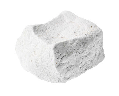 unpolished chalk (white limestone) rock stone on white background