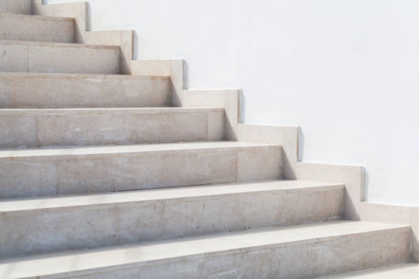 istock Empty stone stairway near white wall, abstract photo 1205997044
