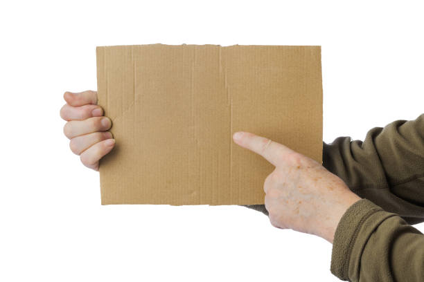 istock Hand of beggar with cardboard 1205999779