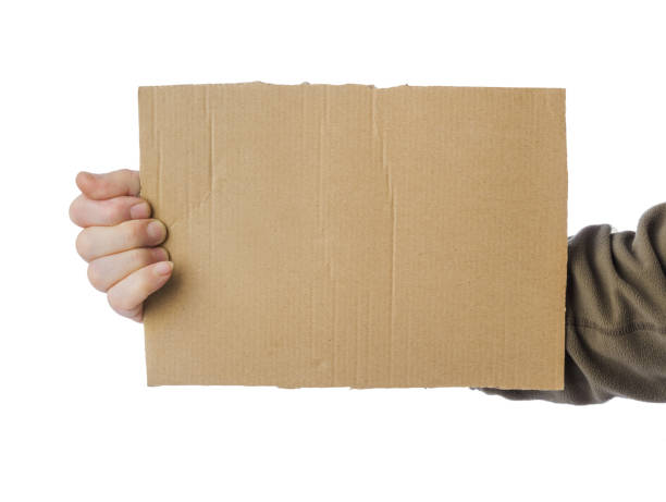 istock Hand of beggar with cardboard 1205999813