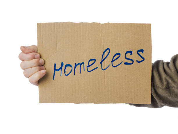 istock Hand with cardboard Homeless 1205999837