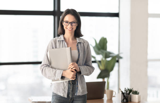 istock Happy manager smiling at camera in contemporary office 1206000824