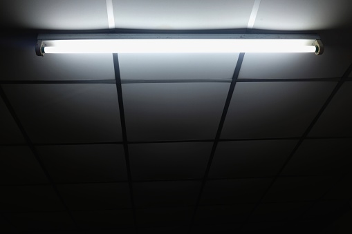 White old fluorescent lamp on ceiling