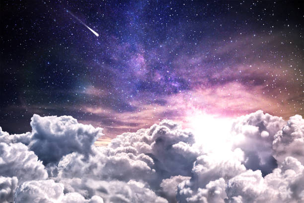 istock Night sky with clouds and stars 1206001250