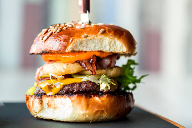 istock Fresh flame grilled bacon cheeseburger on wooden board 1206001908