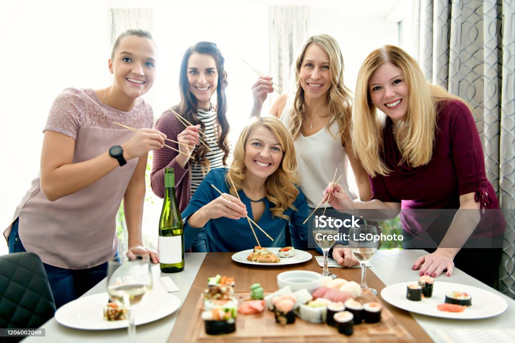 Group Of Attractive And Funny Woman Eating Sushi At Home Stock Photo -  Download Image Now - iStock