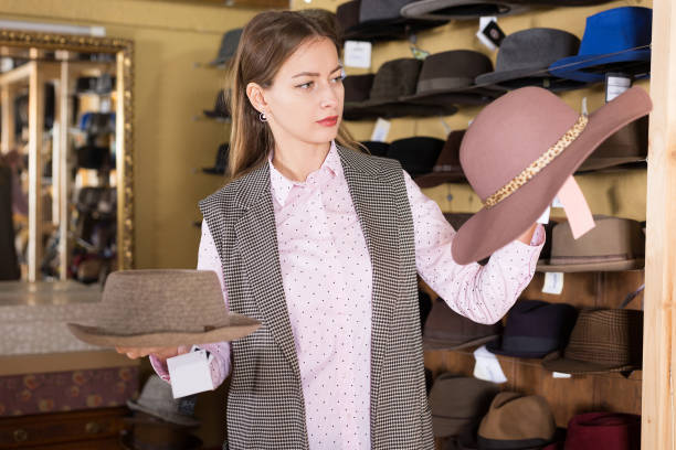 istock Woman choosing hat in store 1206002111