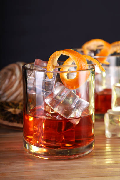 istock Chilled Alcohol Whisky / Rum Drink with Ice Cube and Orange Peel 1206002539