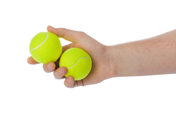 istock Hand with tennis balls 1206004636