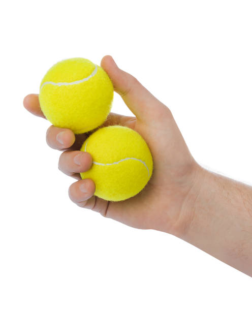 istock Hand with tennis balls 1206004660