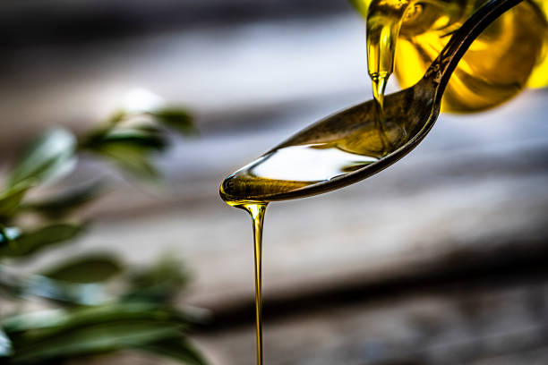 istock Pouring extra virgin olive oil 1206006454
