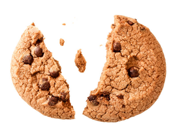 istock Cookies with chocolate pieces broken in half, isolated on a white. 1206006595