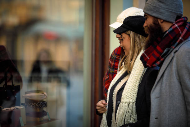 istock Looking at products on a shop window 1206007112