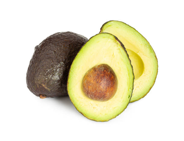 白に分離茶色の新鮮な熟したアボカド - avocado portion brown apple core ストックフォトと画像