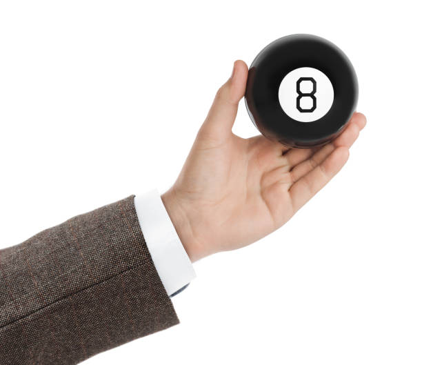 istock Hand with magic billiard ball number eight 1206007671